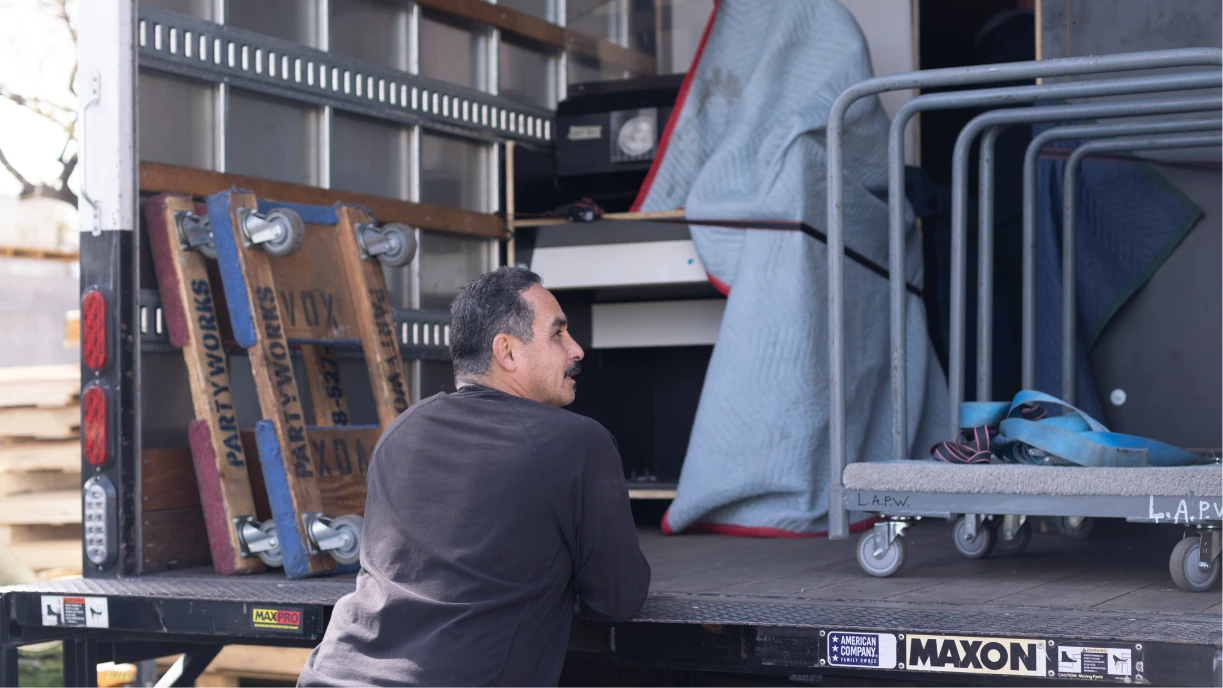 Event rental equipment being loaded onto a delivery truck, demonstrating inventory that requires inland marine insurance protection.