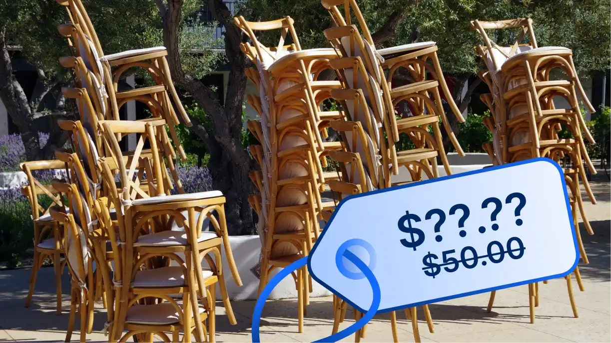 Stack of chiavari chairs with price tags showing increased costs due to tariffs