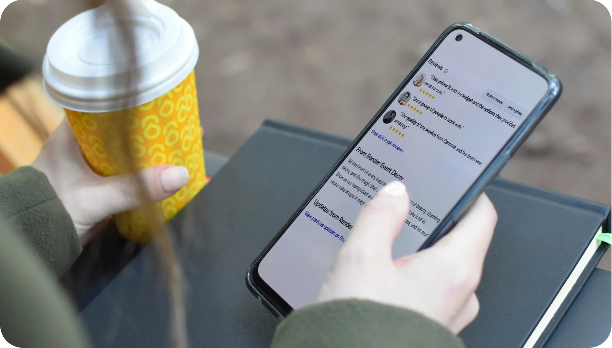 Mobile phone displaying positive Google Business Profile reviews with 5-star ratings for an event rental company