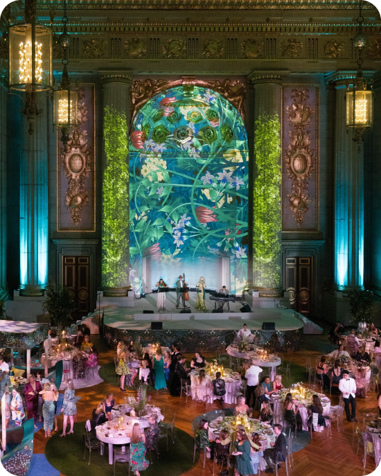 Ridgewells DC brought an Irish fairytale to life with immersive projections, cascading greenery, and candlelit tables